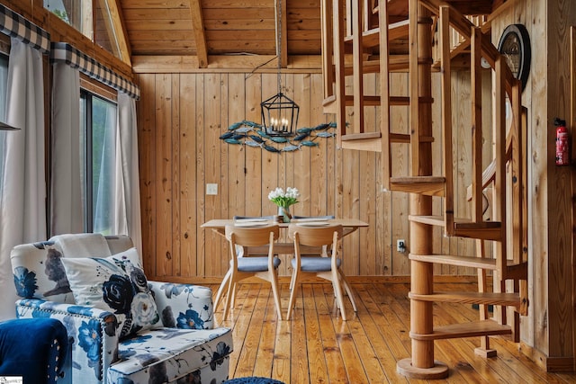 misc room featuring wood-type flooring, vaulted ceiling with beams, wood ceiling, and wood walls