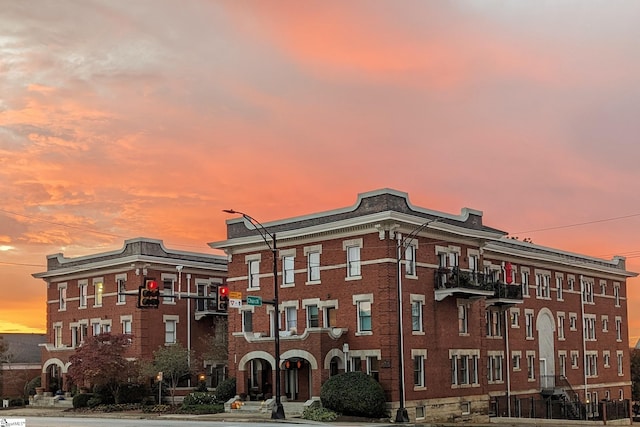 view of outdoor building at dusk