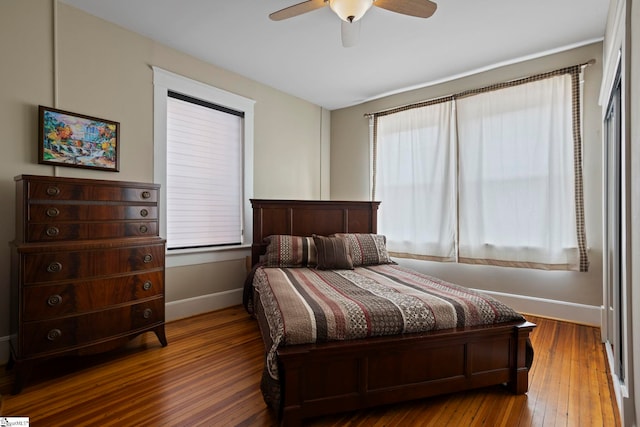 bedroom with wood-type flooring and ceiling fan