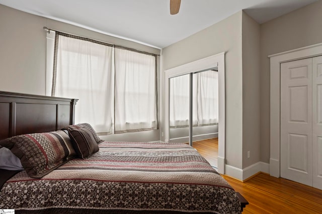 bedroom with ceiling fan and light hardwood / wood-style floors