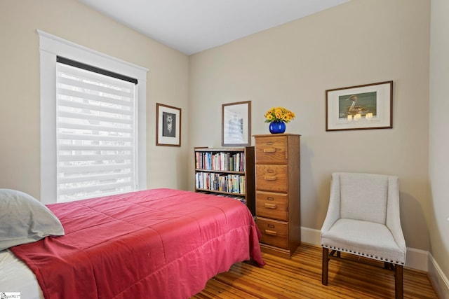 bedroom with wood-type flooring