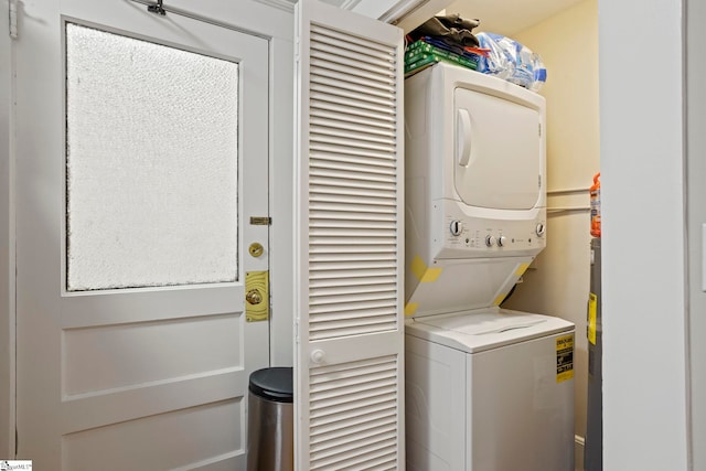 laundry area with stacked washer / drying machine