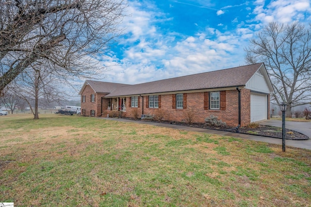 single story home with a garage and a front lawn