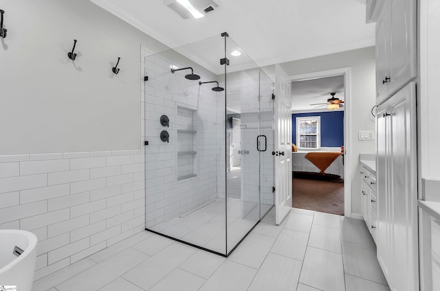 bathroom with tile walls, independent shower and bath, and ceiling fan