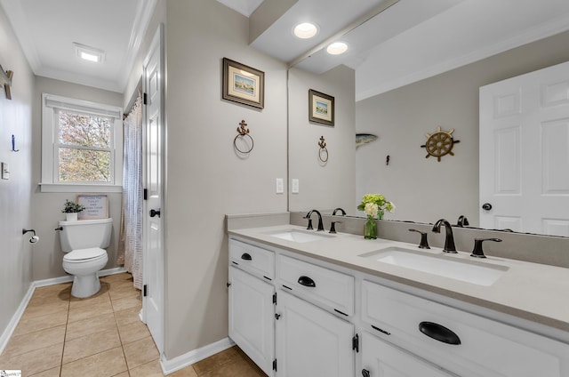 bathroom with vanity, tile patterned floors, ornamental molding, and toilet