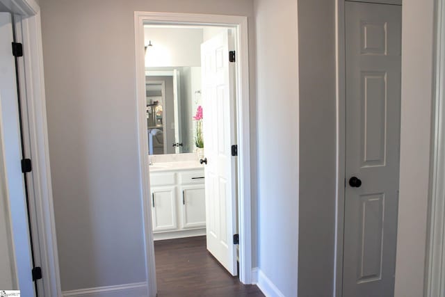 corridor featuring dark hardwood / wood-style floors