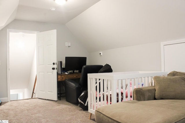 carpeted bedroom with vaulted ceiling