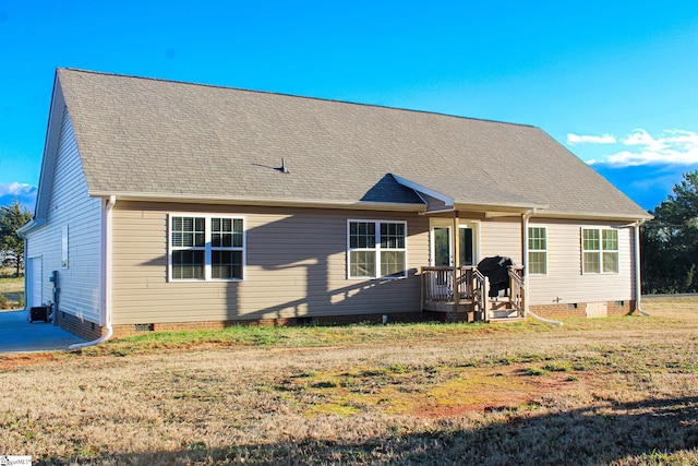 back of house with a yard