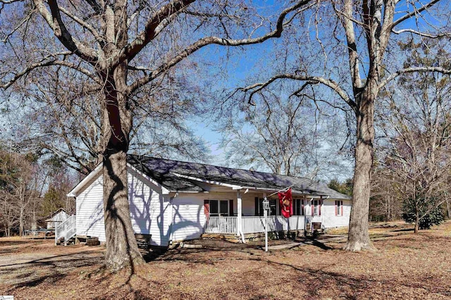 ranch-style house with covered porch