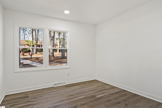 empty room featuring dark hardwood / wood-style floors