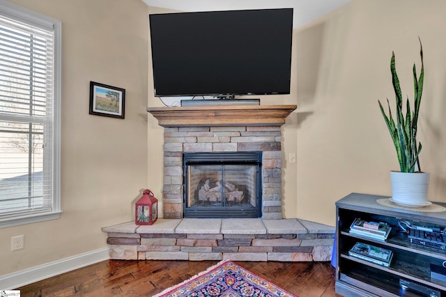 interior details featuring a fireplace and hardwood / wood-style floors