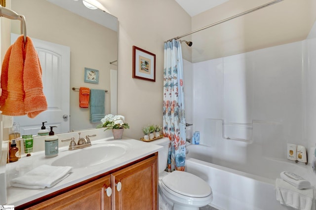 full bathroom with toilet, shower / bath combo with shower curtain, and vanity