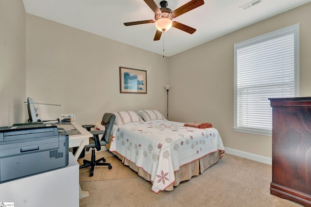 carpeted bedroom with ceiling fan