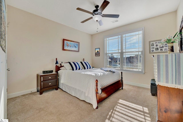 carpeted bedroom with ceiling fan