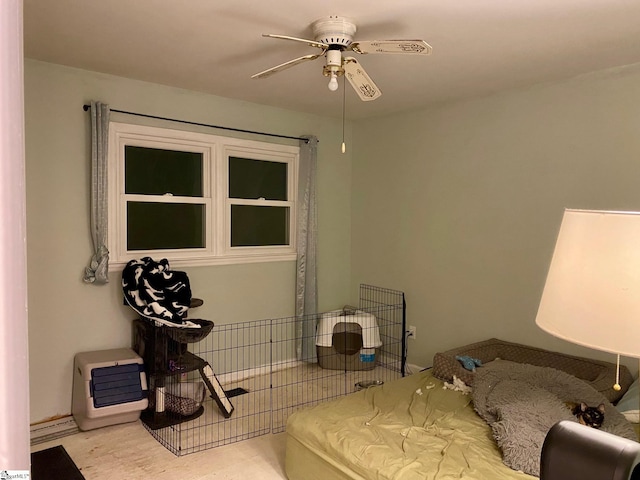 bedroom with heating unit and ceiling fan