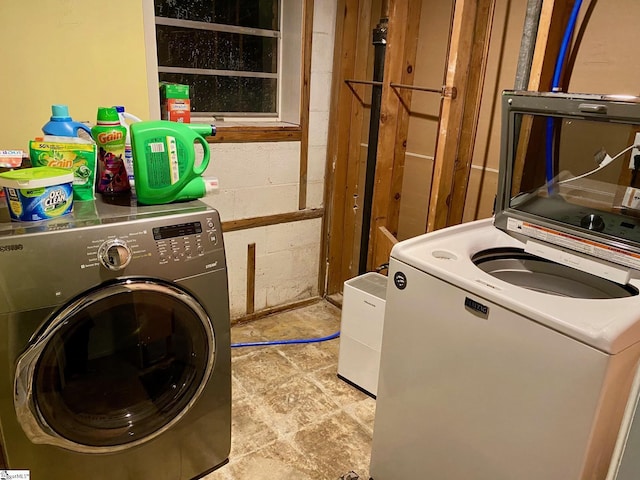 laundry room featuring separate washer and dryer