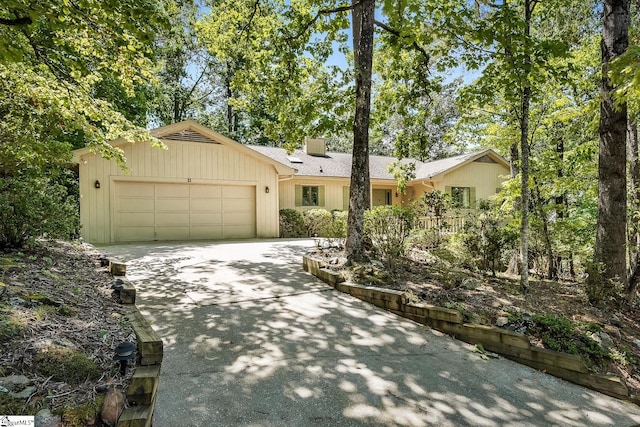 single story home featuring a garage