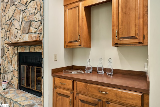 kitchen featuring a stone fireplace