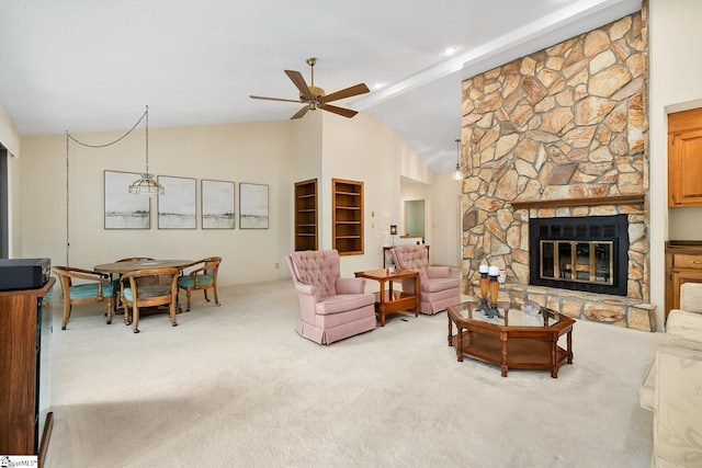 carpeted living room featuring high vaulted ceiling, ceiling fan, and a fireplace