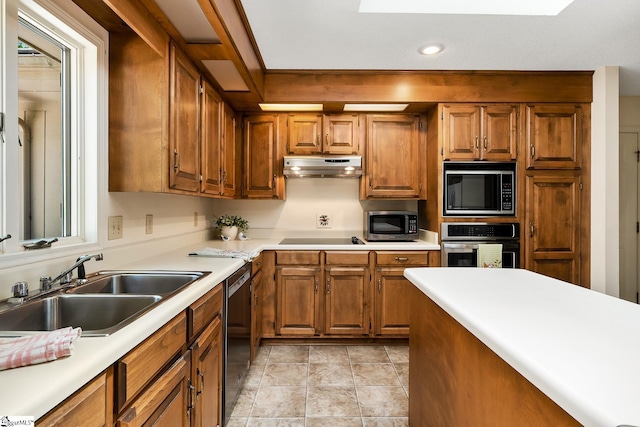 kitchen with sink and black appliances