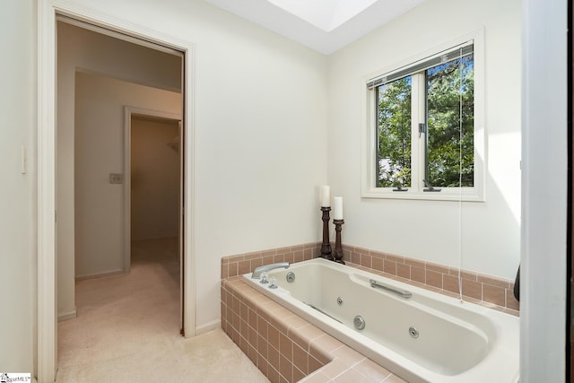 bathroom featuring a relaxing tiled tub