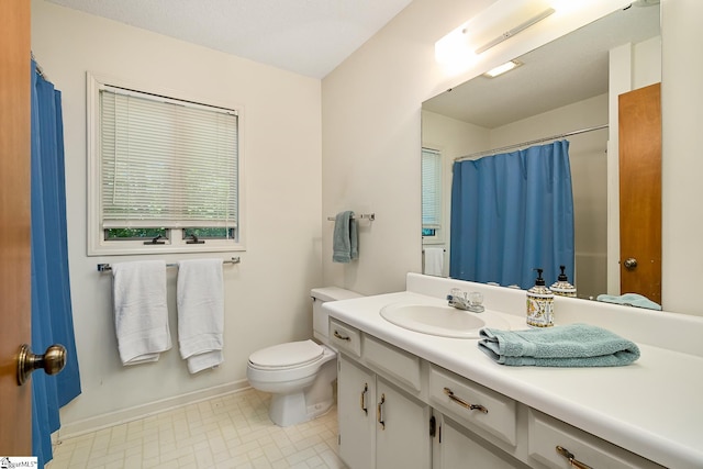 bathroom with toilet and vanity