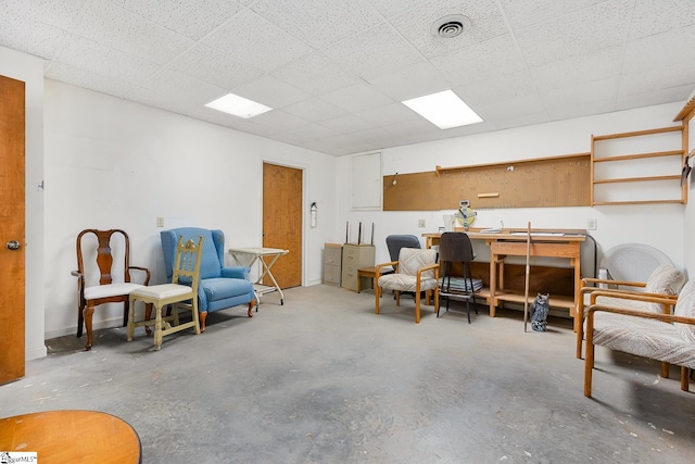 sitting room featuring concrete floors