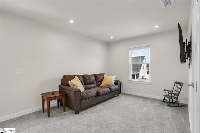 living room featuring light colored carpet