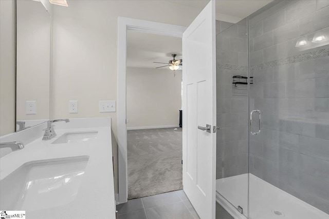 bathroom with tile patterned floors, ceiling fan, vanity, and walk in shower