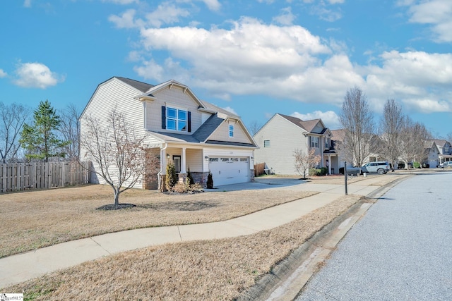 view of front of property featuring a garage and a front yard