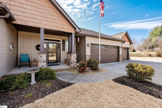 entrance to property featuring a garage and covered porch