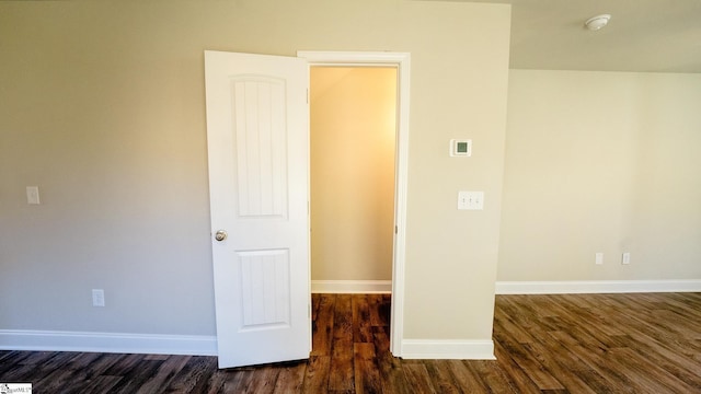 spare room with dark hardwood / wood-style floors