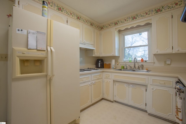 kitchen with sink and white appliances