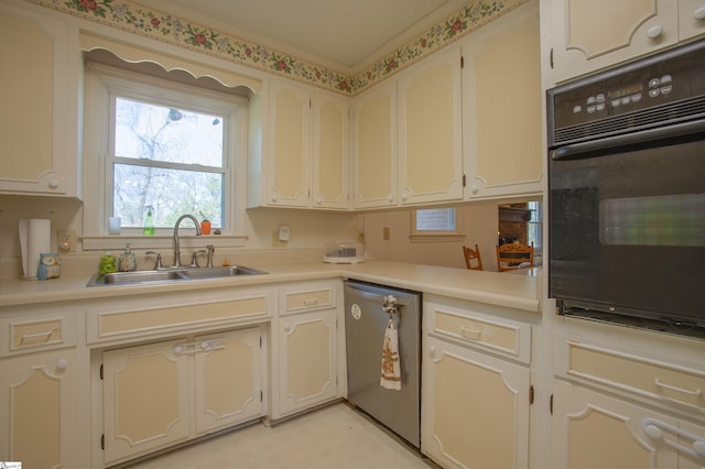 kitchen with white cabinets, oven, dishwasher, and sink