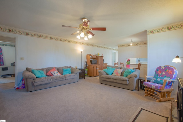 carpeted living room with ceiling fan