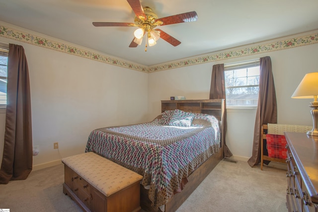 carpeted bedroom featuring ceiling fan