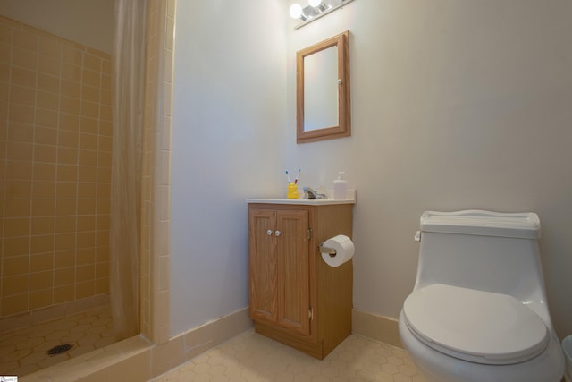 bathroom with toilet, vanity, and walk in shower