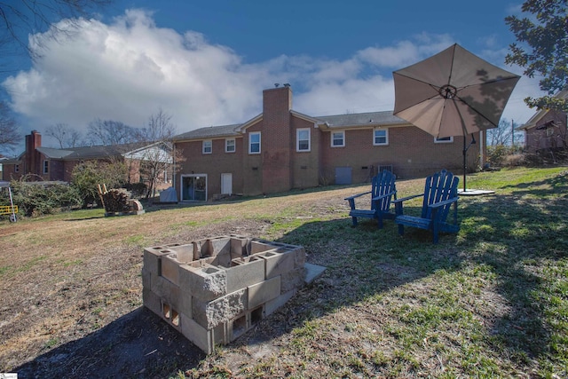 view of yard with an outdoor fire pit