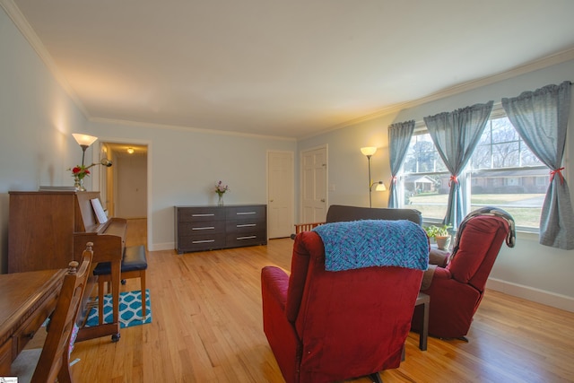 living room featuring light hardwood / wood-style flooring and ornamental molding