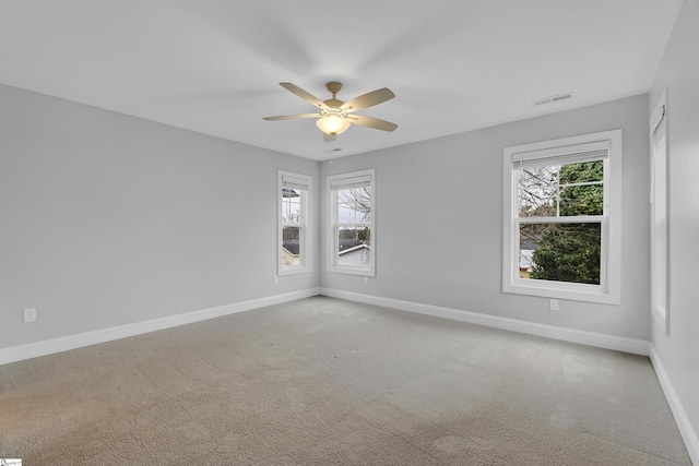 unfurnished room with ceiling fan and carpet floors