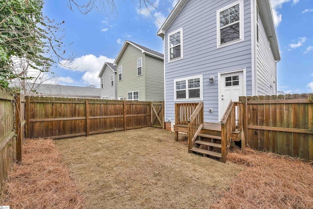 rear view of house featuring a deck