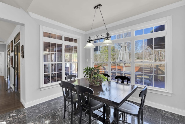 dining space with crown molding