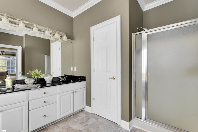 bathroom featuring ornamental molding, vanity, and an enclosed shower