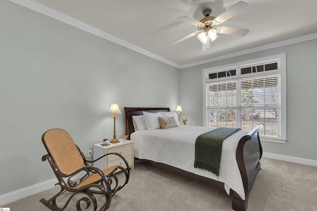 carpeted bedroom featuring ornamental molding and ceiling fan