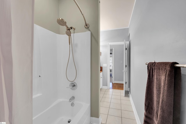 bathroom with tile patterned floors and shower / bath combo with shower curtain