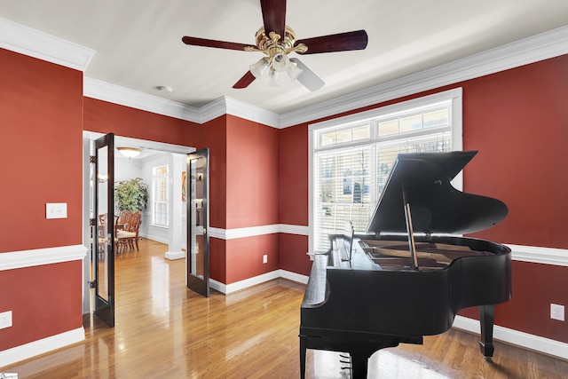 sitting room featuring hardwood / wood-style flooring and ornamental molding