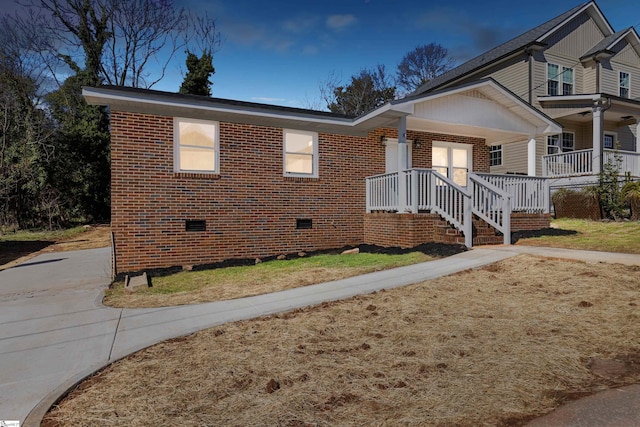 view of front of home with a porch and a front yard