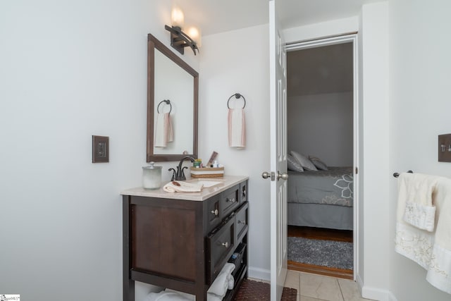 bathroom with tile patterned flooring and vanity