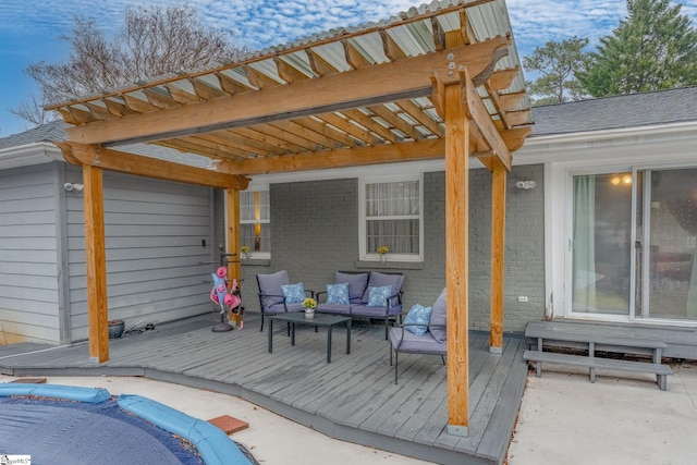 wooden terrace with an outdoor living space and a pergola