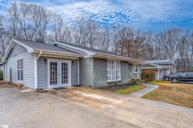 single story home featuring french doors